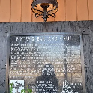 a plaque on the side of a building