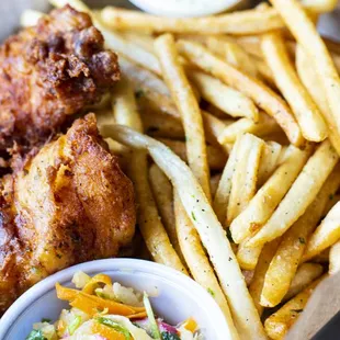 a basket of fried chicken and french fries