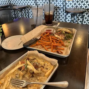 Loaded fries and what&apos;s left of the awesome burger.