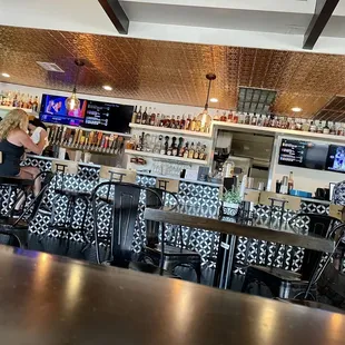a woman sitting at the bar