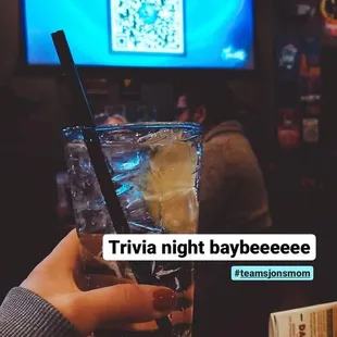 a person holding a drink