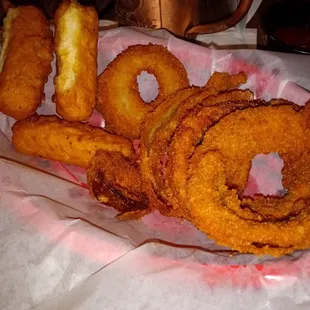 Burnt onion rings and cheese sticks that were stuck together so breading was raw.