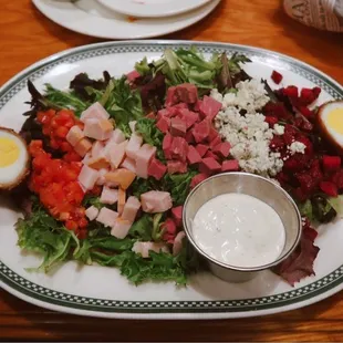 Irish Cobb Salad: Diced corned beef, turkey, bacon, diced tomatoes, apple beet salad, blue cheese crumbles, Scotch Eggs, mixed baby greens.