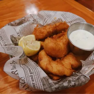 Irish Fish &amp; Chips: North Atlantic fresh cod fish in ale batter with wedge fries. Served with a side of malt vinegar and tartar sauce.
