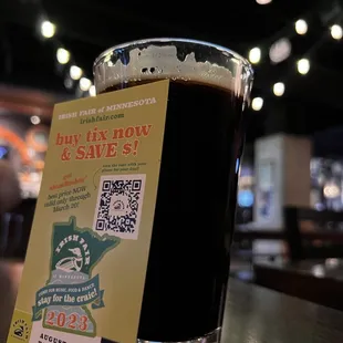 a pint of beer on a table