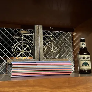 a bottle of beer and coasters