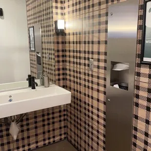 a bathroom with a sink and mirror