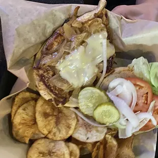 Chicken sandwich with requested only 1/2 slice of cheese, instead of the typical two slices served. Homemade chips are excellent!