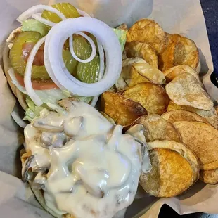 Grilled chicken smothered with onions mushroom &amp; Swiss cheese with side of homemade chips! Delicious