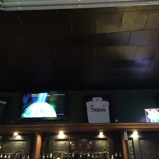 a bar with a large screen tv