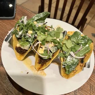 a plate of tacos on a table