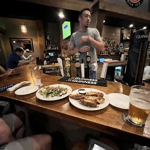 a man standing at a bar