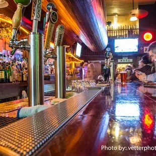 Extensive bar area, beautiful woodwork thought the place. Credit: Jim Vetter Photography