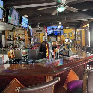 a bar with several televisions