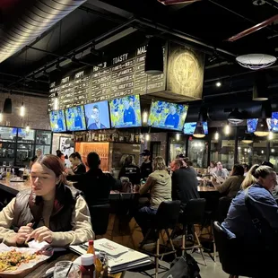The full-service bar and the multitude of television screens