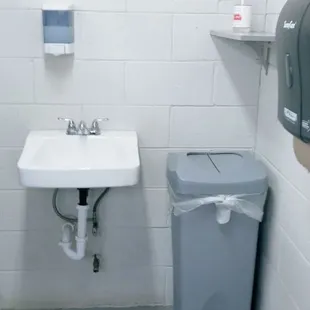 Clean restroom available paper towels and toiletries.