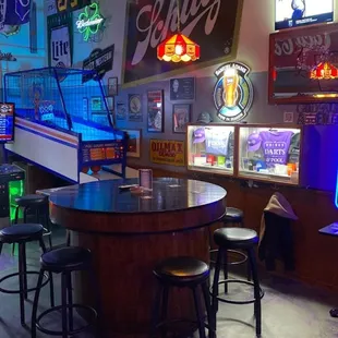 Back seating area with arcade games, and jukebox.
