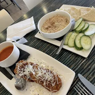 a plate of food and a bowl of soup