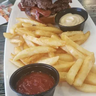 Bacon Blue Burger (broken bun) with a extra side of garlic aioli and ketchup.