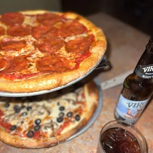 Cheese pizza with olives and mushrooms &amp; pepperoni pizza.
