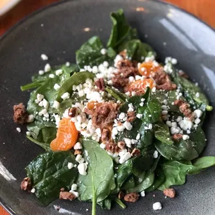 Spinach and satsuma salad with goat cheese candied nuts tossed in a refreshing vinaigrette