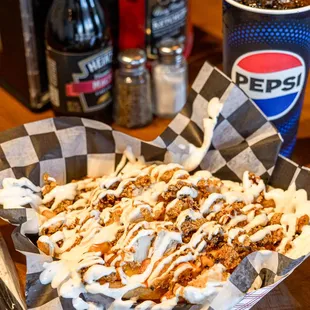 Loaded Fries (new york style breaded chicken with garlic sauce, hot sauce and cheese)