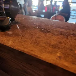 Photo from the dining area showing dust and hair.  Right next to where customers eat.