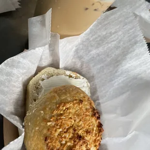 Iced honey lavender latte with an onion bagel and cream cheese