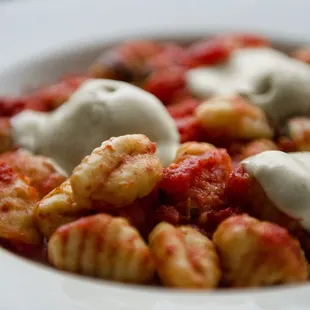 a close up of a bowl of pasta