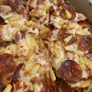 Pepperoni and pineapple pizza