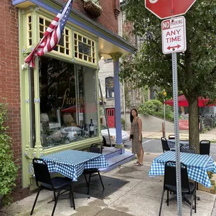 a woman standing in front of a store