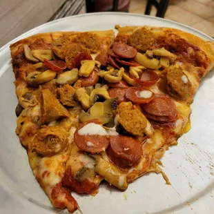1 slice with pepperoni,  mushroom,  hot sausage...