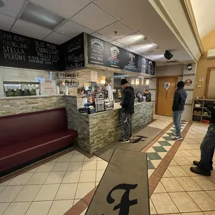 people standing at the counter