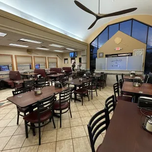 a dining room with tables and chairs