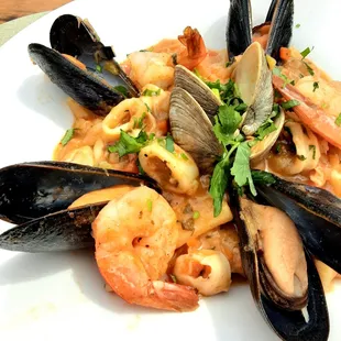 a plate of seafood and pasta