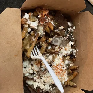 a box of food with a fork in it