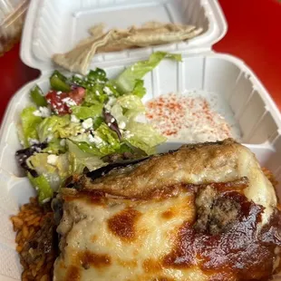 Musaka on top of Algerian spicy rice.