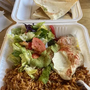 Side salad, hummus, cilantro hummus and tzatziki. A side of pita and the Algerian spicy rice.
