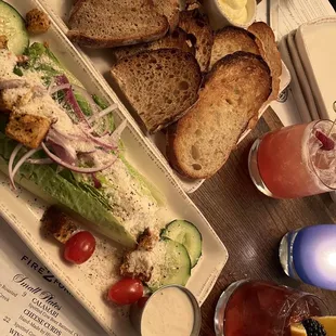 Caesar salad and bread appetizer