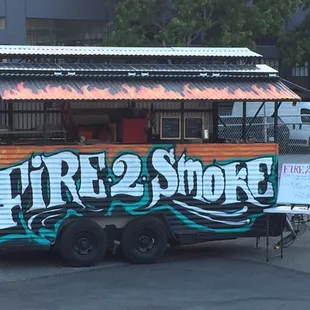 a food truck with graffiti on it
