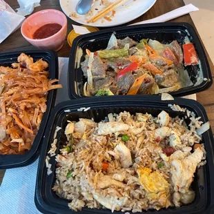 three containers of food on a table