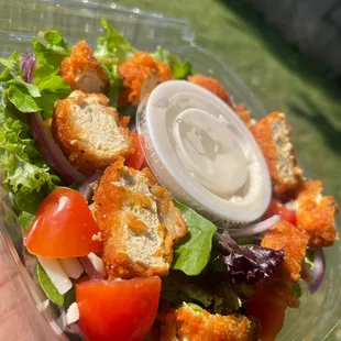 a salad in a plastic container