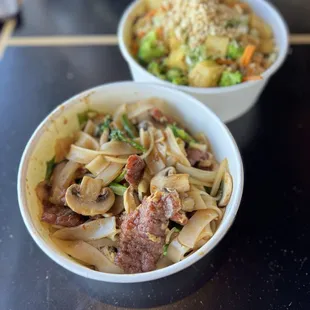 two bowls of food on a table