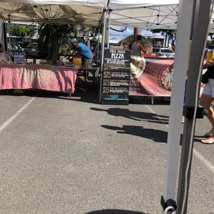 a tent set up in a parking lot
