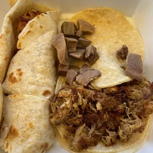 shrimp taco on flour, tripe taco and carnitas taco