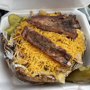 Spud with 3 meats: ribs, pull pork and brisket.