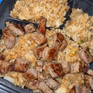 Rice with a side of steak.