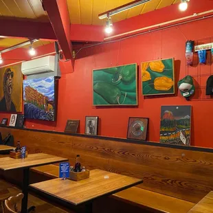 a dining area with tables and chairs