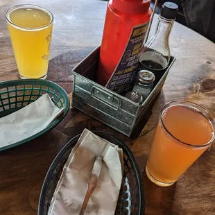a table with drinks and condiments