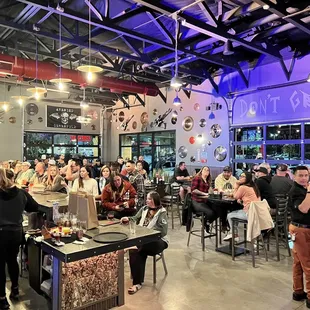 a crowd of people sitting at tables
